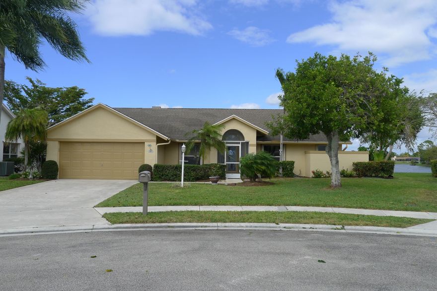 Lake front Wellington 4 bedroom 2 bath screened pool home with INCREDIBLE WATER VIEW!!!and boat dock don't miss this opportunity to own on the water enjoy the lake, or just sit in your solar heated pool. This water front Cul De Sac home features Open floor plan with 4 bedrooms and two baths. high ceilings, tile floors, granite kitchen counter tops accordian shutters. A Great community with awesome neighbors. Did I mention an INCREDIBLE WATER VIEW