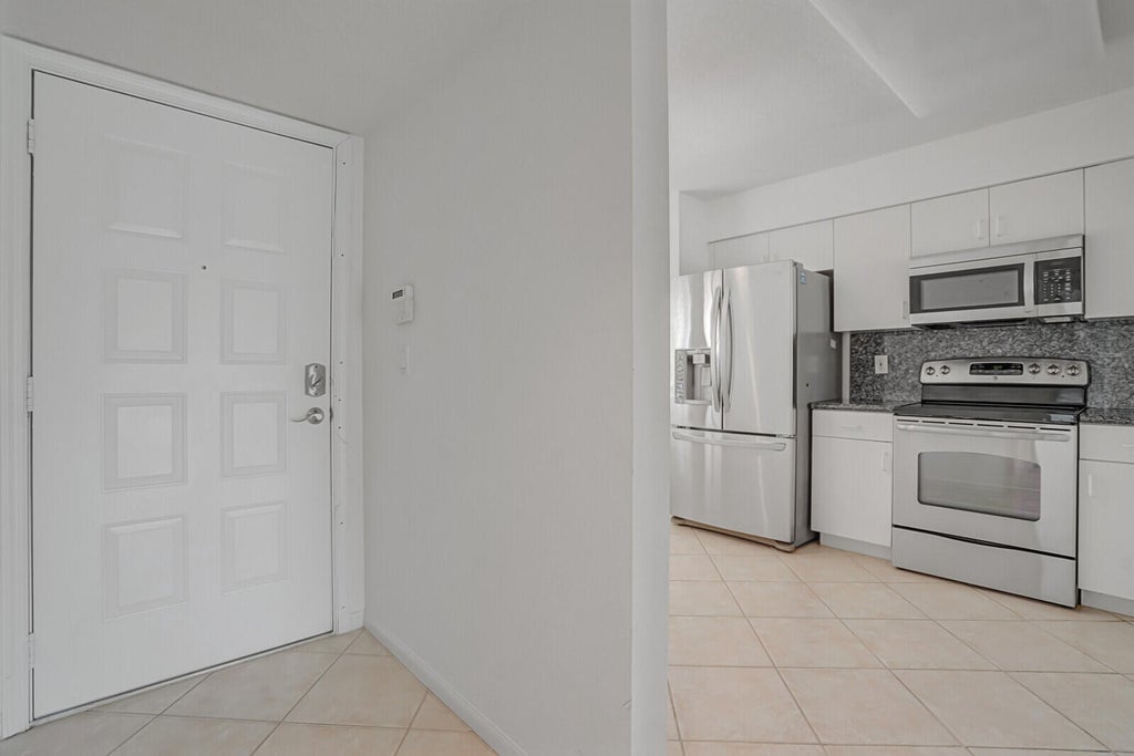 Photo of 5874 CRYSTAL SHORES Drive #308, Boynton Beach, FL 33437 (MLS # B26085409)