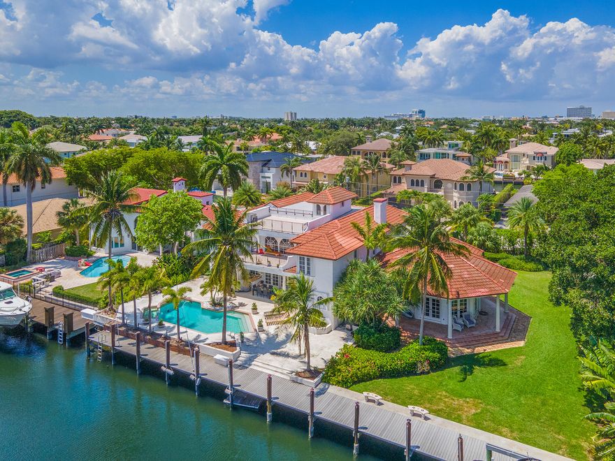 LOCATION! Incredible 2-Story Estate in Exclusive Las Olas, Seven Isles. 154' of Water Frontage, Deepwater Ocean Access for Mega Yachts!  No Fixed Bridges! Grand Gated Entrance, Paver Driveway! Oversized Tropical Lush Double Lot! Massive Rooftop Terrace with Water & City Views.  New Seawall & Composite Dock with 180-amp Service, 16,000 lb Boat Lift. Paradise awaits with Custom Pool, Spa & Covered Patio. Dramatic Vaulted Ceilings, Bright Open Windows & Floor Plan.  Huge Chef's Kitchen, Quartz Counters, Tray Ceilings, Recessed Lighting, Snack Bar & Breakfast Area. Formal Dinning Room, Custom Library & Fireplace.  Entertainment Room with Full Bar. Master Bedroom ,Private Balcony, Office Nook, Exercise Room, & Sitting Area with Stunning Fireplace. Minutes the beach, Fine Dining & Shopping!