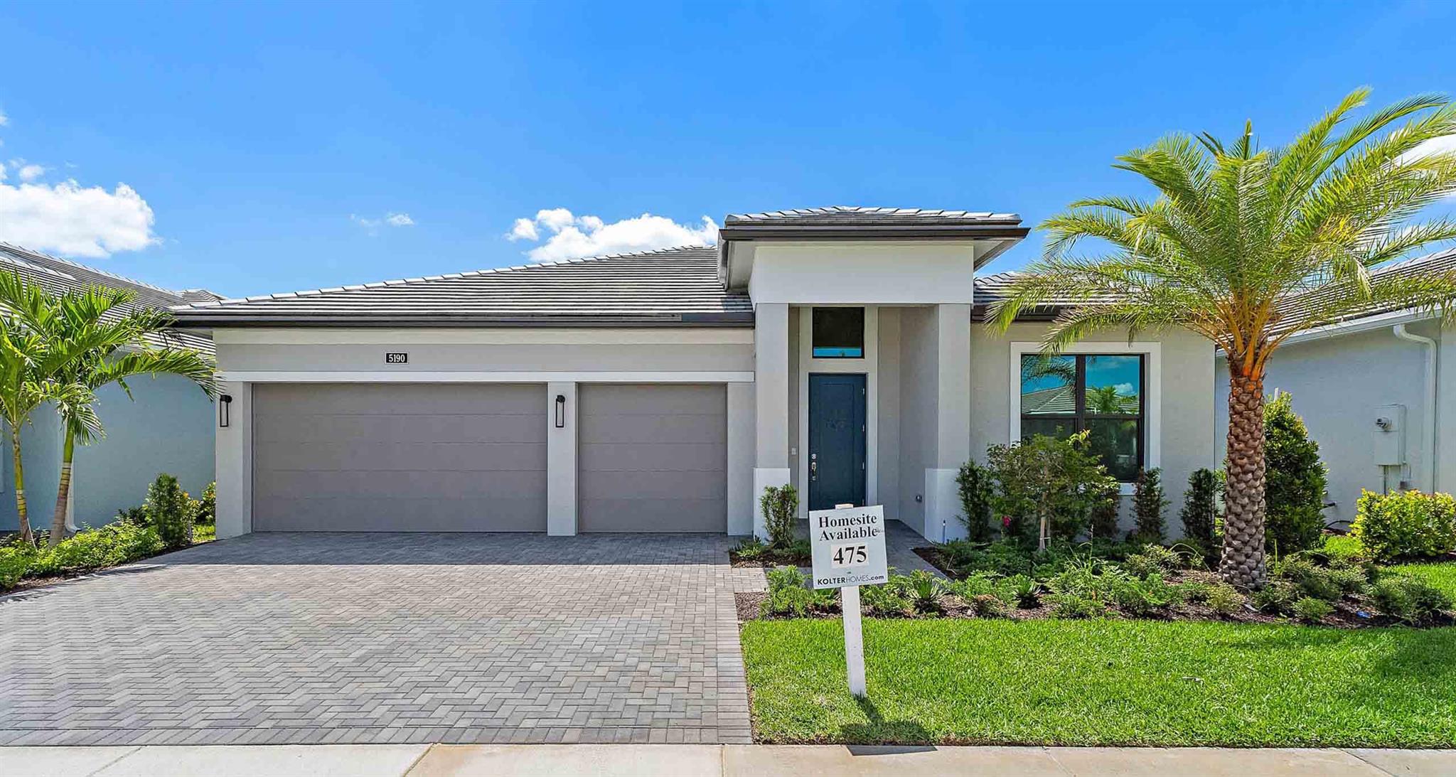 **New Construction - Move In Ready** This brand-new Paige floorplan, built by Kolter Homes, is situated on a private homesite in Westlake's only gated 55+ community. The home includes 3 bedrooms, 3 bathrooms, and a 3-car garage. The home also includes gas cooking in the kitchen along with a 3'' thick quartz kitchen island, and a matching full-height quartz backsplash. There is a 12-foot wide by 10-foot high sliding glass door leading to the lanai where there is an added 5-foot privacy wall with gas, electric, and water connections for a future summer kitchen. This Paige includes built-in cabinets and a quartz counter in the walk-in pantry, 2nd tier upper cabinets, and under cabinet LED lighting.