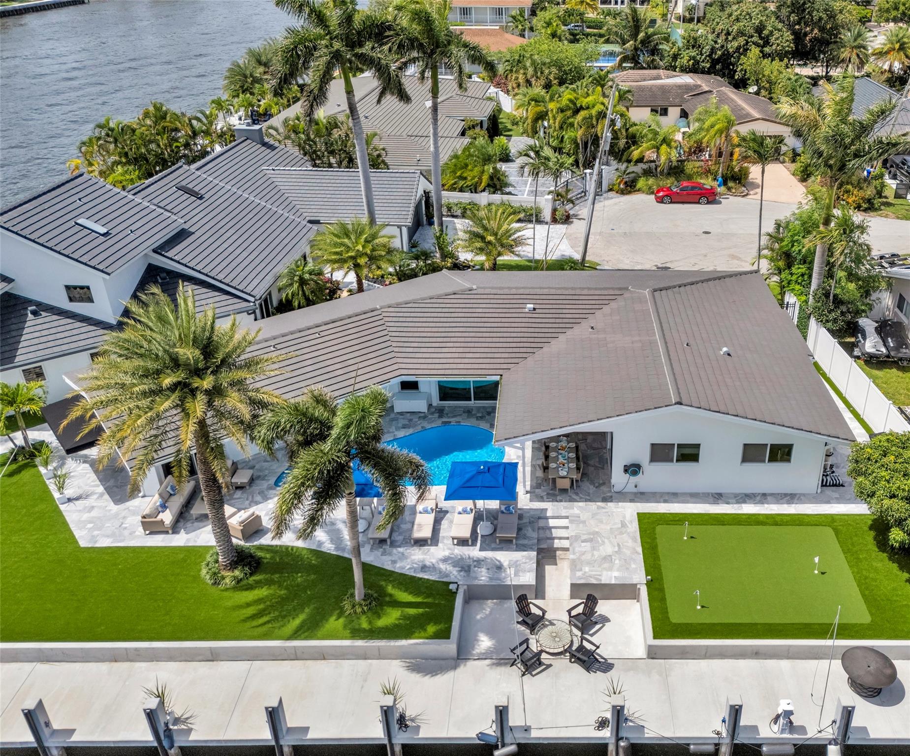 A One-of-a-Kind Waterfront Masterpiece | 100 Ft of Deep Water Dock | No Expense Spared. Villa Azul Vacation Home is a one-of-a-kind luxury retreat in Fort Lauderdale’s Bermuda Riviera, offering dockage w/ no fixed bridges and stunning Intracoastal views. Just a 5-minute walk to the beach, open-concept living, coastal interiors, and a private backyard oasis w/ a resort-style heated pool. No expense was spared in creating this elegant waterfront escape. Perfectly located walking distance to restaurants, shops, & local treasures, Villa Azul offers the ultimate South Florida experience for discerning travelers & boating enthusiasts alike. This is a Vacation Rental & pricing is for 6+ months off season. If you are looking for shorter term please contact us for pricing for weeks/months desired.