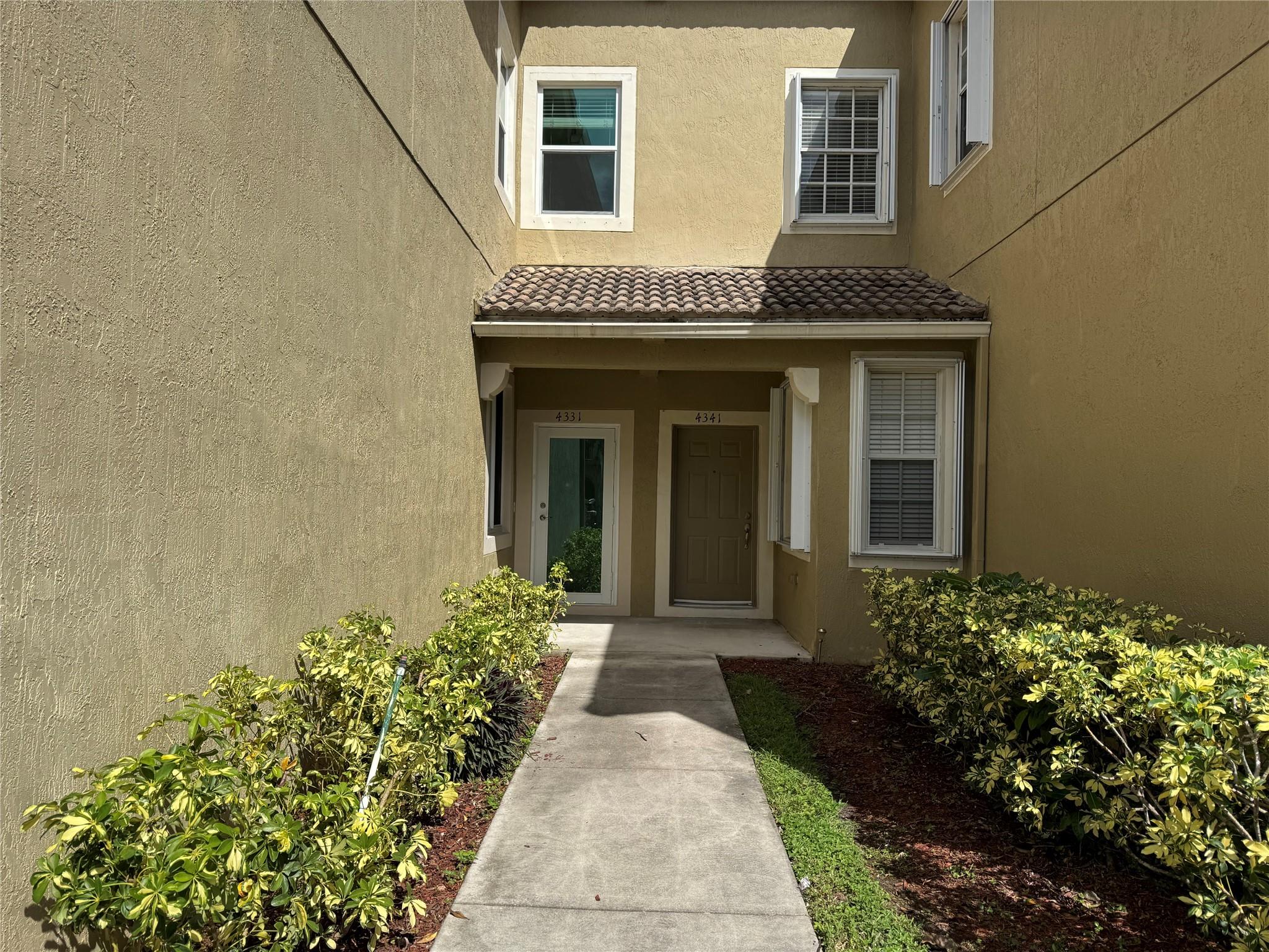 Beautiful lake view three bedroom townhome tastefully renovated. Tiles throughout the property, no carpet. Spacious kitchen features two refrigerators, stainless steel appliances and quartz countertop. Bathrooms have been beautifully renovated. All windows and doors are hurricane impact proof. Rent includes water, sewer and internet. Main bathroom has a shower separate from the perfect tub to soak and relax, dual sinks for his and hers and the guest bathroom has a tub and shower combination. Main bedroom over looks the paeceful lake and features a large walking closet. Perfect back patio overlooking the lake just bring your grill. The community has a great clubhouse with a swimming pool, gym, tennis and basketball courts and a social clubroom perfect for private parties. Split Bedrooms