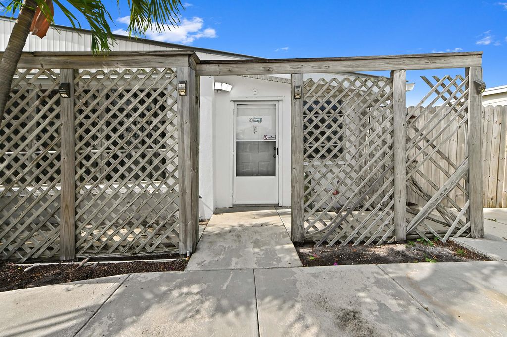 Photo of 3892 Nowata Road, Lake Worth, FL 33462 (MLS # B26042857)