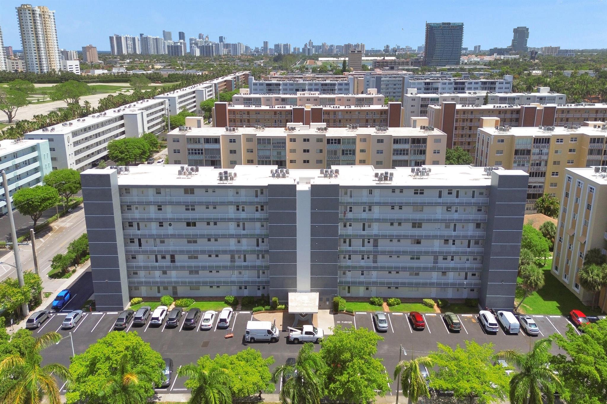 Discover coastal living at its best with this beautifully updated 2-bedroom, 2-bath condo in vibrant Hallandale Beach! Step into a bright and spacious layout featuring warm wood flooring, tile countertops, and crisp white appliances. Enjoy morning coffee or evening breezes on your private balcony with newly renovated railings. This well-maintained community offers fantastic amenities including a sparkling pool, clubhouse, and secure 1-car garage. Each floor includes convenient access to two washer and dryer units. The building has been freshly painted, enhancing its modern appeal. With banks, shops, and supermarkets just moments away--and the beach only minutes from y