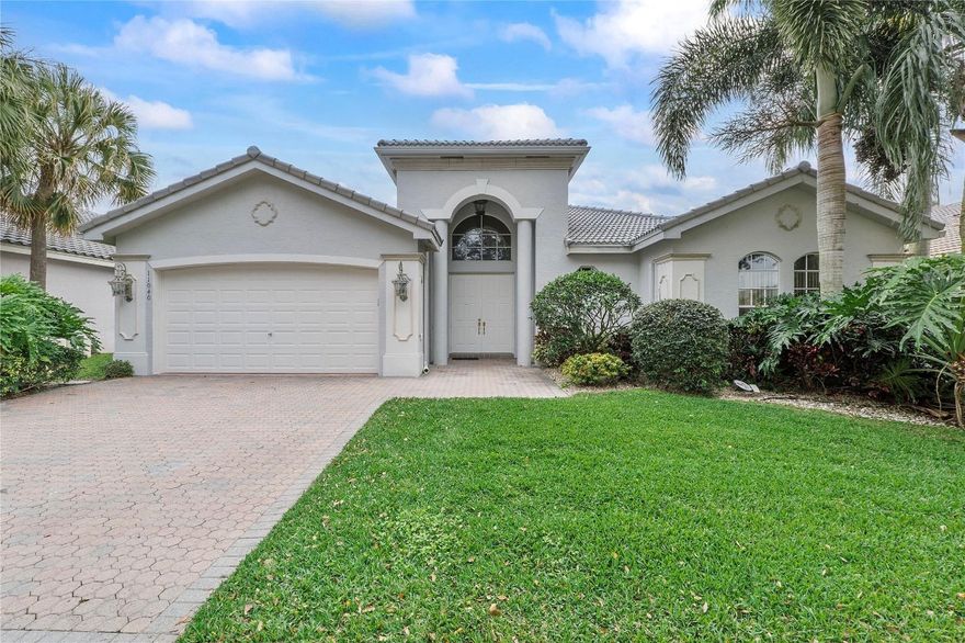 Welcome home to this warm and welcoming property in Valencia Isles! It is wonderful and well-maintained home with great features. The BRAND NEW ROOF and freshly painted interior add a touch of modernity and cleanliness. The triple split floor plan is a fantastic feature, providing privacy and separate spaces for different needs. The large walk-in laundry room is a practical and convenient space, making household chores more manageable. The kitchen  & family room are an open floor plan. Walk outside to the paver lanai which has a view of the lake giving a perfect spot to relax and enjoy some quiet time. You are minutes away from the clubhouse that offers a cafe, card room, pool, pickleball and many lifestyle amenities. The country club way of living without the membership fee.