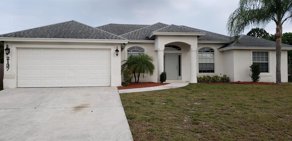 Photo of 2137 SW Idaho Lane, Port Saint Lucie, FL 34953 (MLS # R10745853)