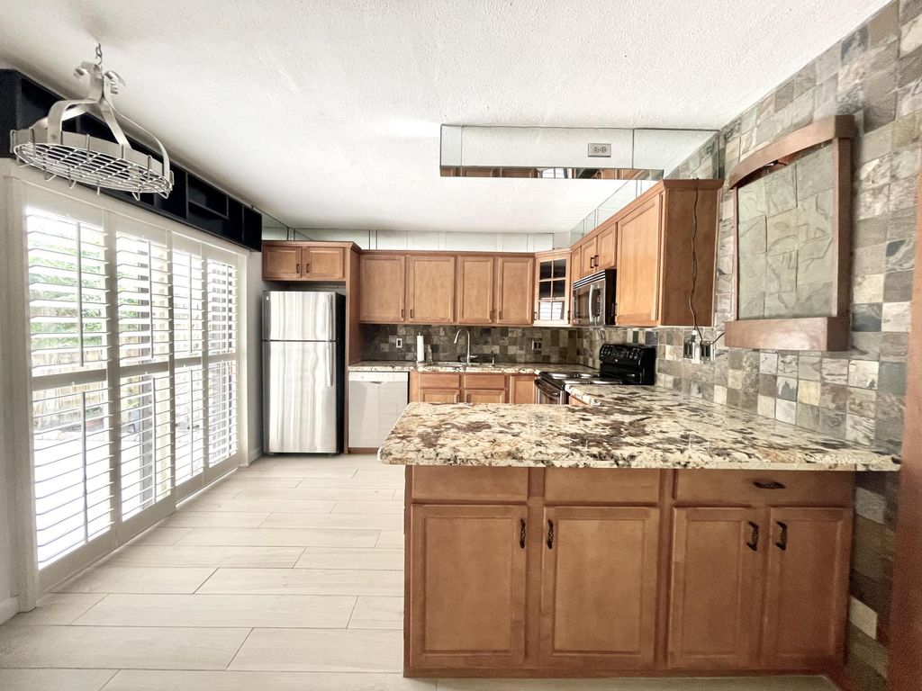 Photo of 65 Lake Arbor Dr, Palm Springs, FL 33461 (MLS # R11000414)