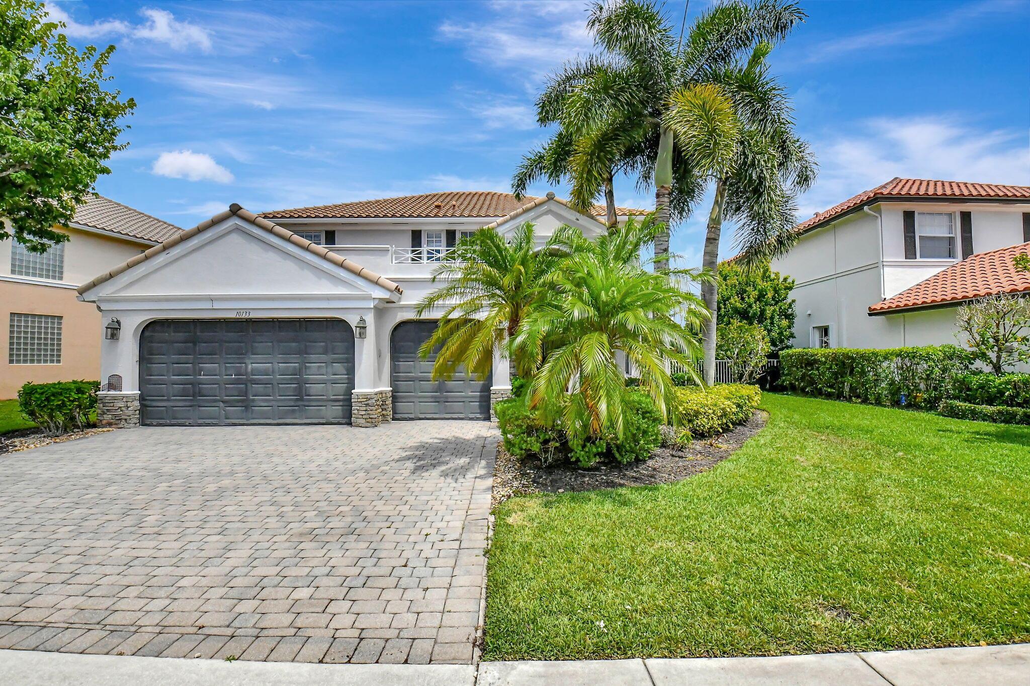 Outstanding lake views from this palatial executive home tucked away in an ideally located quaint and quiet gated community! This home features a 3 car garage, 2 bedrooms and 2 full baths on the first floor, and double french doors leading out to a covered lanai facing the lake. The large and open kitchen has everything you'll need for get togethers, small or large. Upstairs you will find a grand master suite with a study/retreat within the bedroom perfect for an en suite office, gym, baby room, etc. and also features 2 walk in closets, a wet bar, and master bath with new shower, separate soaking tub, and dual sinks.