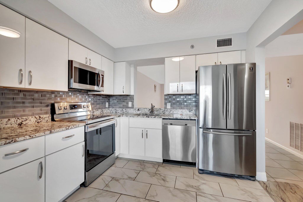 Photo of 14623 BONAIRE Boulevard #502, Delray Beach, FL 33446 (MLS # B26088453)