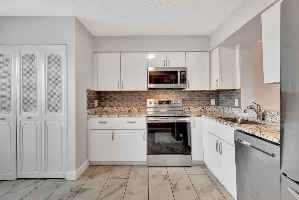 Photo of 14623 BONAIRE Boulevard #502, Delray Beach, FL 33446 (MLS # B26088453)