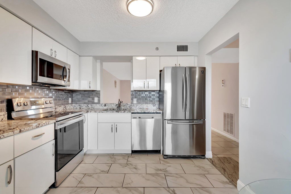 Photo of 14623 BONAIRE Boulevard #502, Delray Beach, FL 33446 (MLS # B26088453)