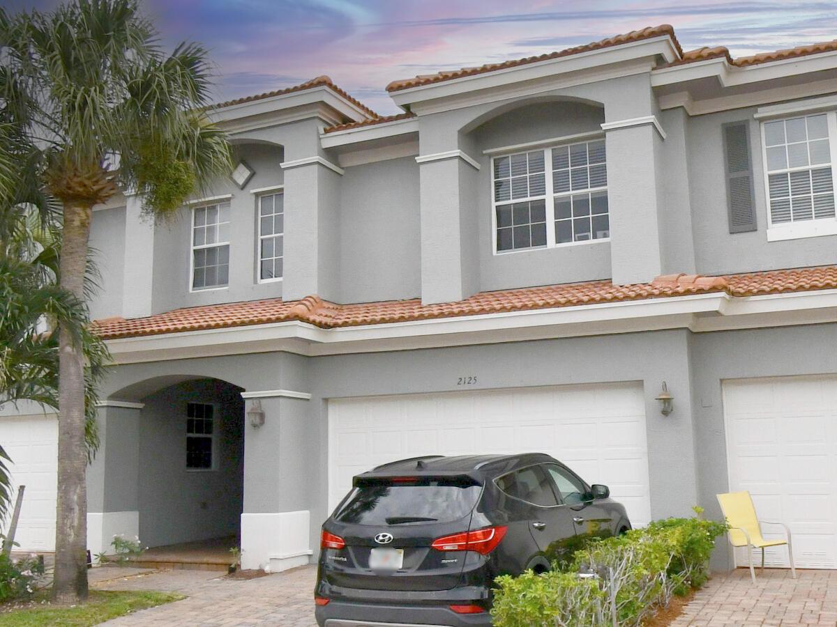 ONLY FIRTS MONTH AND SECURITY! Spacious 3-bedroom, 2.5-bath townhouse with a 2-car garage, offering over 2,100 sq. ft. of comfortable living space in the gated community of Newport Isles. The kitchen features granite countertops, stainless steel appliances, 42'' cabinets, and a built-in pantry under the stairs for extra storage. Upstairs, you'll find a generous loft and a split-bedroom layout for added privacy. The primary suite includes a large walk-in closet and an en-suite bathroom with dual vanities, a jetted tub, and a separate shower. Enjoy lake views from your private backyard - perfect for relaxing or entertaining. Amenities include a resort-style pool, fitness center, tennis and basketball courts. Minutes away from Tradition, I-95, shopping, dining, and more!