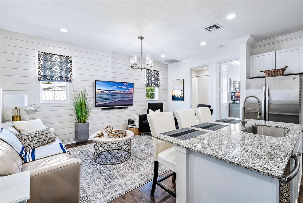 This extensive guest house apartment is one of only a hand-full in the picturesque community of Botanica. This gorgeous retreat features a fully custom designed layout including pristine hard wood floors throughout, all GE stainless steel appliances, granite countertops, and is fully furnished with a professional touch of modern interior design. The kitchen is set up with all custom cabinetry, a full island that seats 3, and an open concept great for entertaining. The bathroom reminds you of an island escape, and the large bedroom provides a King size bed along with an ideal walk-in closet. The separate entry located behind the main house allows you to come and go at your leisure.