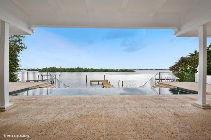 Stunning, Lake Front Clarence Mack regency with exceptional water views.  Nestled within a private cul-de-sac.  Classic, small scale regency with high ceilings and historic details.  Renovated interiors featuring a gym/media room; multiple bedrooms; guest kitchen/laundry and so much more.  Dock; infinity pool; beach access.  The BEST OPPORTUNITY in Palm Beach.