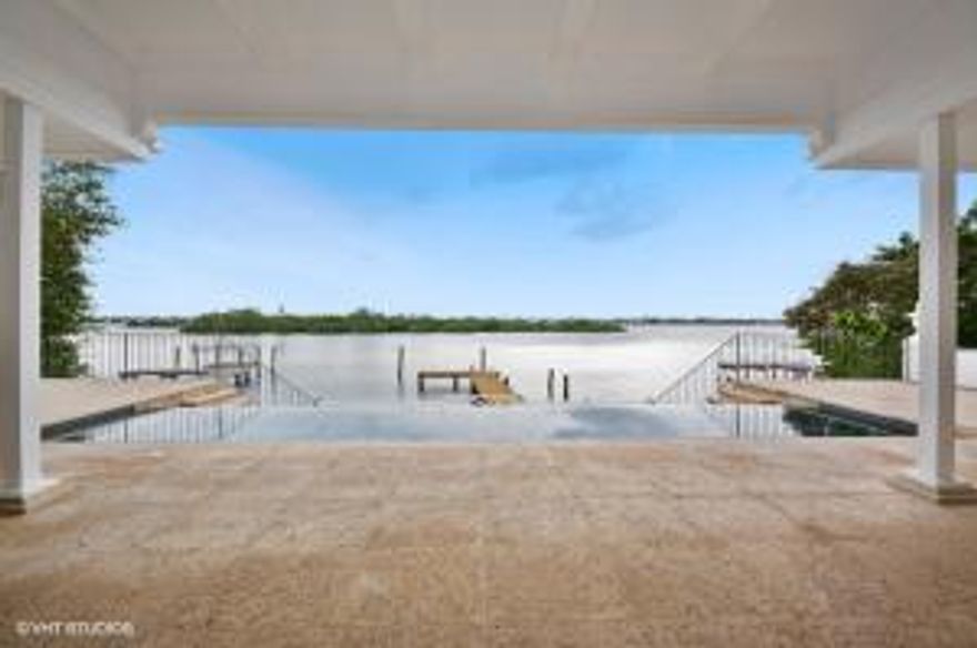 Stunning, Lake Front Clarence Mack regency with exceptional water views.  Nestled within a private cul-de-sac.  Classic, small scale regency with high ceilings and historic details.  Renovated interiors featuring a gym/media room; multiple bedrooms; guest kitchen/laundry and so much more.  Dock; infinity pool; beach access.  The BEST OPPORTUNITY in Palm Beach.