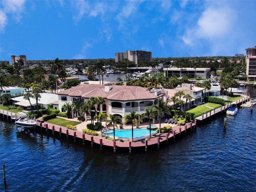 An incredible opportunity to own a NE facing Pompano Beach point lot with wide open views of Lake Santa Barbara. 8092sf of total area featuring of 232' of ocean access dockage with an oversized pool and spa. 6 Beds with 2 BONUS ROOMS (can be 8 Bedrooms) and 6 full bathrooms with 2 additional powder rooms. Large volume ceilings when you enter the home, formal dining room for entertainment, elevator, 3 car garage, and a gourmet kitchen with views of the water.