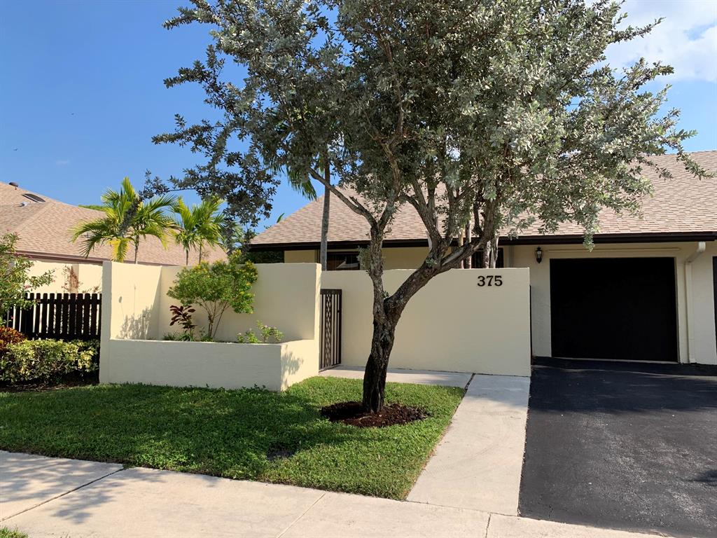 3/2 Villa includes a garage and private yard with views of the lake only minutes to Atlantic Ave & downtown Delray. Here's your opportunity to own in the desirable WoodLake Community with low HOA fee that includes cable and internet also provides a clubhouse, pool, fitness center and tennis courts. This villa is one story featuring an open concept living room with high volume ceiling that overlooks the atrium that allows a lot of natural light. The tropical landscaped entrance with privacy walls offers a relaxing patio area or room to put a private pool.