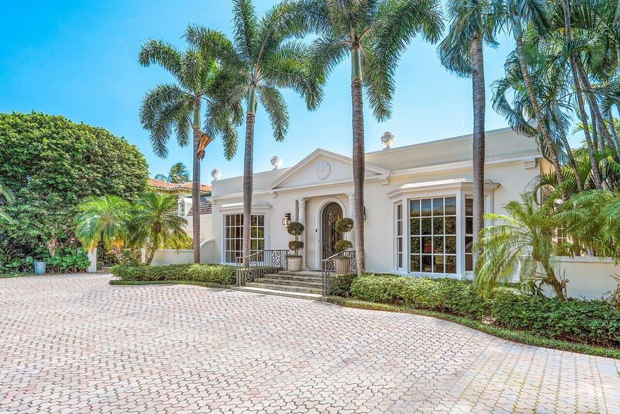 Classic Palm Beach Regency home, designed in 1959 by Henry Harding, on a very generous 16,500+ sqft estate section lot. Meticulously renovated and maintained with full impact glass, a new two car garage and wine storage topped by a guest/staff quarters apartment. The home features 11-12' ceilings, multiple spaces for entertaining and guests, and as many as 5 bedrooms with en suite baths depending on a buyer's needs. First floor primary bedroom features his/her baths and closets. And the oversized lot allows room for a gracious auto forecourt, large pool and airy backyard.