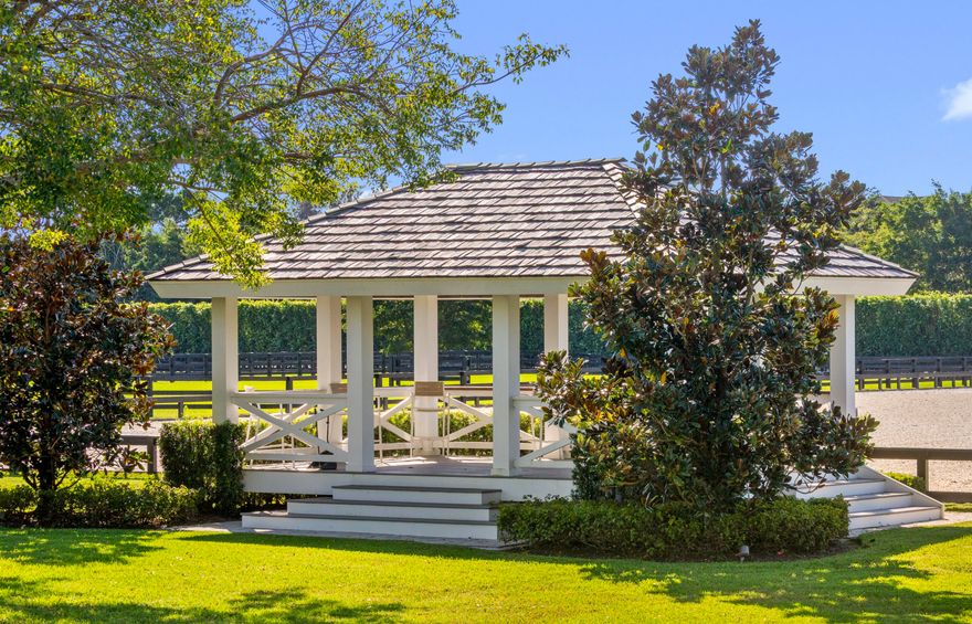 Truly one of Wellington's most exceptional equestrian estates, this 20+ acre property spans two parcels and offers a seamless blend of thoughtfully designed equestrian amenities and a fully reimagined luxury residence - each finished with uncompromising attention to detail.

The open-air 20-stall barn was designed for professional-level functionality and effortless daily use. It includes multiple tack rooms, three grooming stalls, two covered wash racks, a commercial-grade laundry room, generous storage, an RO system, and covered jump storage. A beautifully finished rider's lounge provides a full kitchen and bath, while two renovated one-bedroom staff apartments occupy the upper level. Additional equestrian amenities include a 150' x 300' riding arena with viewing area, a 90-foot round pen, eight expansive paddocks, a five-acre stick-and-ball field, and a fully fenced perimeter.
The main residence, originally constructed in 2000, underwent a comprehensive architectural addition and top-to-bottom renovation from 2020 to 2021, with every surface, system, and interior detail replaced or upgraded. Encompassing 11,274 sq ft of living space, the home features six bedrooms and 7.2 bathrooms, including an oversized upstairs game room or sixth bedroom with kitchenette, full bath, private balcony, and its own exterior entry. Additional interior spaces include a beautifully appointed office, an inviting card room, a dedicated dog room, and beyond generous storage throughout the home. Completed by a fully air-conditioned four-car garage.
The home's finishes showcase a refined blend of custom craftsmanship and contemporary luxury. Each room tells its own design story, highlighted by hand-painted tile, bespoke cabinetry by Woodland Cabinetry, Thibaut wall coverings, James Martin vanities, shiplap detailing, and lime-washed vaulted oak ceilings in the dining room. Mechanical and system upgrades include eight individually zoned AC units, one for each bedroom - a full-property RO system, Kohler whole-house generator, and extensive storage throughout.
The kitchen flows seamlessly into the main living spaces and balances culinary performance with everyday elegance. Appointments include a Thermador six-burner gas range with an induction zone, double ovens, a Sub-Zero refrigerator and freezer, and a spacious scullery with an additional 32" Sub-Zero refrigerator and freezer and abundant custom storage. A dedicated coffee station offers refrigerated drawers and an icemaker, while the bar features four Sub-Zero refrigerator drawers.
The primary suite is both luxurious and private, offering dual bathrooms, dual closets, a dedicated exercise room, and direct access to the pool terrace.

Outdoor living is elevated with a resort-style sunken pool featuring in-water loungers, a rounded-edge spa, multiple spillovers, deck jets, and dramatic fire bowls. The expansive covered patio includes a complete outdoor kitchen with two grills, refrigerators, icemaker, sink, and mounted TV. A lighted walkway leads to the floodlit pickleball court with its own viewing gazebo. Mature landscaping envelopes the home, creating privacy and a lush, tranquil backdrop. A rare opportunity to acquire an estate of this scale, craftsmanship, and qualityoffering luxury living paired with top-tier equestrian facilities. More than an equestrian's dream, this property is a sanctuary the entire family can enjoy.
DISCLAIMER: All information provided to you regarding this Property by Realtor and her associates has been obtained from third parties such as the Multiple Listing Service, public records and other sources. All Buyers should independently verify all information provided regarding this Property. The Sellers, Realtor and Broker make no representation as to the accuracy of this information. All Buyers should perform their own independent due diligence regarding this Property before executing a Contract for Sale and Purchase for this Property.