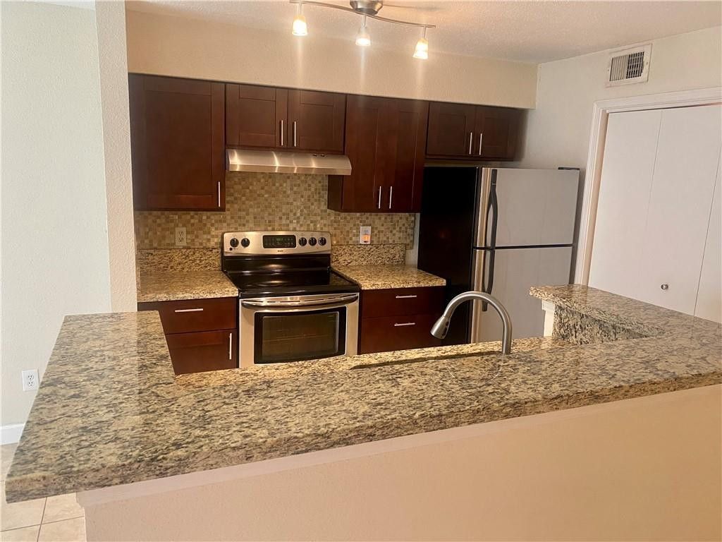 Photo of 777 Riverside Drive #1512, Coral Springs, FL 33071 (MLS # B26022930)