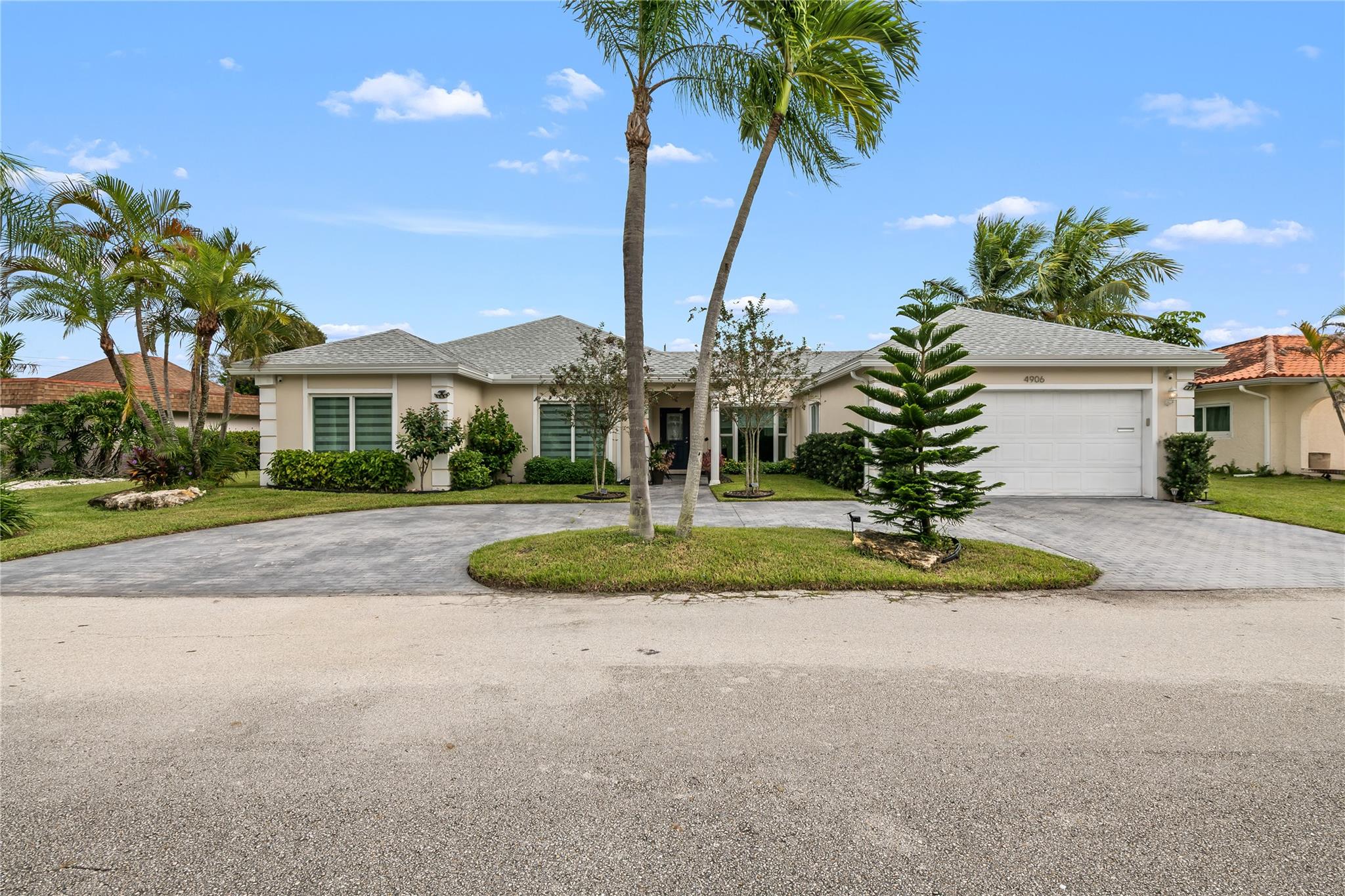 Welcome to this beautifully upgraded residence located in the sought-after Woodlands community, offering resort-style living in a serene golf course setting. This elegant home features impact glass throughout, ensuring both safety & energy efficiency. Step inside to discover rectified oversized porcelain floors that create a modern, seamless look, elegant silhouette window coverings. Gourmet kitchen. Enjoy the best of Florida living with a heated pool & an extended screened enclosure, perfect for entertaining or relaxing in privacy year-round. The garage has been thoughtfully designed w a/c & add'll insulatiion, ideal for working from home yet remains fully functional as a garage. Experience refined living in one of Tamarac’s most established & picturesque golf course communities.