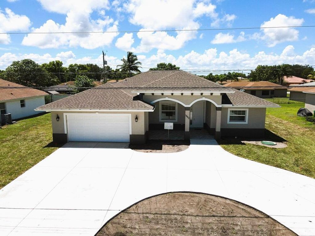 Photo of 1880 SE Berkshire Boulevard Blvd, Port Saint Lucie, FL 34952 (MLS # R10819606)