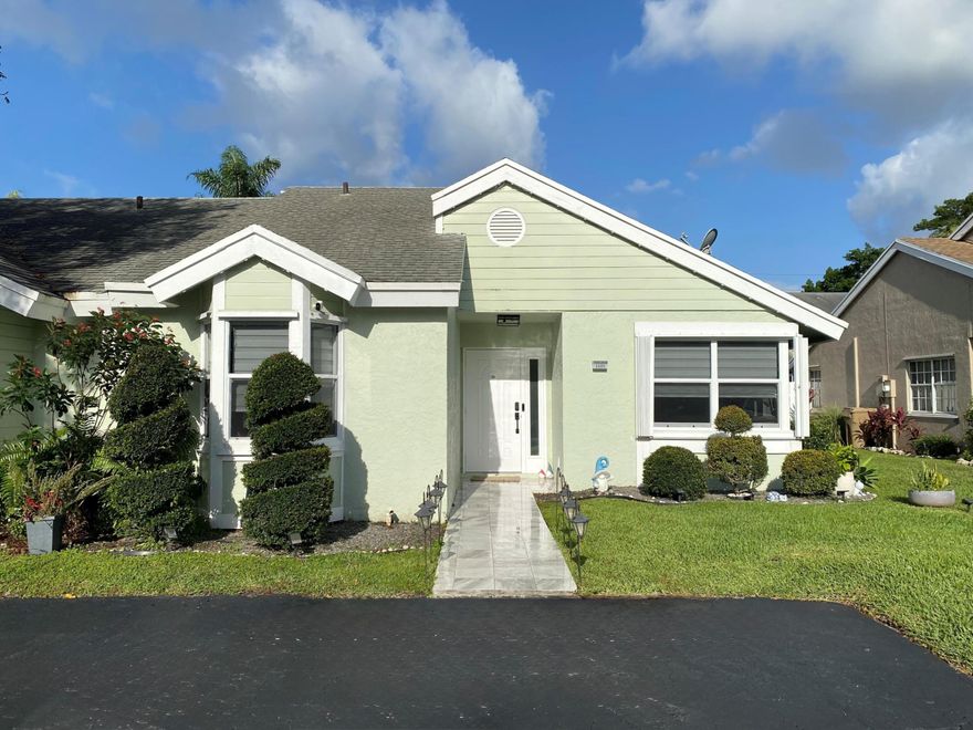 This upgraded 2/2 Villa with 2 parking spots is a great starter or retirement home. The home is located in a great quiet community in Davie, close to major roadways shopping and Airport. Designer kitchen with pullouts with double corner window to make it feel brighter & lighter, includes all appliances about 5yrs. old and has a built-in enclosure for your full-size washer and dryer. Flooring is Tile & Laminate to make it easier to maintain the home. A/C is about 5 yrs. old. Upgraded Primary Bath, Master has a Walk-in closet as well as a secondary closet. On the patio is a covered Pergola with remote screens to open or lower as you prefer as well as an exterior Storage Room. The yard is fenced in for privacy for those relaxing days when you are outside enjoying your Florida Lifestyle.