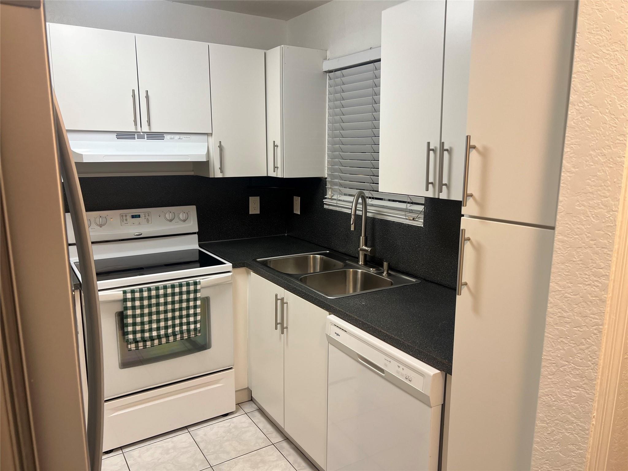 Beautiful 2 bed, 2 bath updated condo for rent in JEANNIE Gardens in Hialeah! Bright and clean with tile floors throughout and fresh paint. Washer and Dryer in unit. Close to schools, parks, shopping, and dining. Easy access to I-75, Palmetto Expressway (826), and the Florida Turnpike. Just minutes from Westland and Amelia Earhart Park. Quiet gated neighborhood with assigned parking. Ready to move in!
