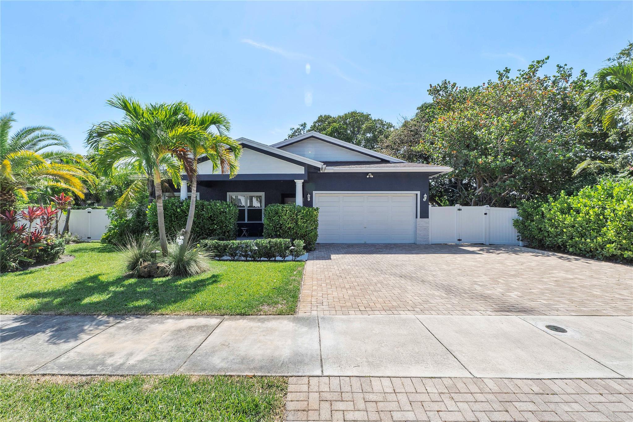Built in 2016, this beautifully maintained, newer-construction home is set on an oversized lot surrounded by lush, mature tropical landscaping. Inside, an open-concept layout features elevated ceilings, generously sized bedrooms, and abundant storage throughout. The kitchen offers a clean, neutral aesthetic with granite countertops, rich wood cabinetry, and stainless steel appliances. The spacious primary suite includes a large walk-in closet and a private en-suite bath. The expansive backyard, fully enclosed by a new PVC privacy fence, provides plenty of space to add a pool. Ideally located near Aldi, Downtown Oakland Park, the vibrant Culinary Arts District with Funky Buddha Brewery, as well as beaches, major highways, and the airport. Easy to rent.