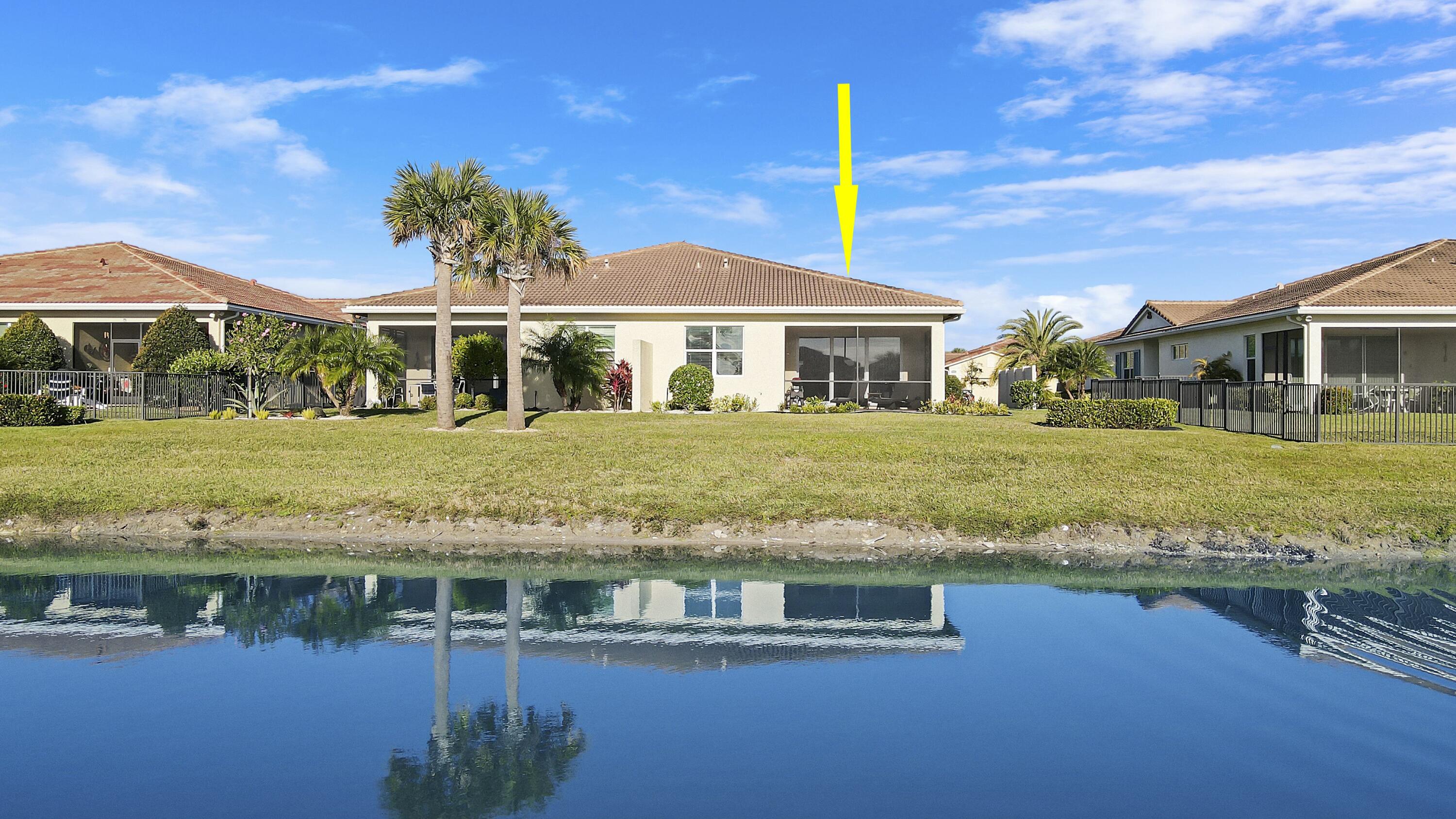 LAKESIDE LOCATION!!! BEAUTIFUL 2BR+DEN/2BA/2CG VILLA WITH SPACIOUS YARD! This popular 'Treviso' model is on trend with current style and will not disappoint! Bright and spacious GREAT ROOM style plan includes kitchen w/white cabinetry, QUARTZ COUNTERS, SS appliances, single basin stainless sink, glass subway tile backsplash, under cabinet lighting, built-in wine cooler, center island & pendant lighting! Master suite overlooks the lake and has walk-in closet with custom shelving, upgraded ensuite w/frameless glass shower, tile listello and vanity w/dual sinks & QUARTZ COUNTERS. Additional bedroom plus a den w/shiplap accent wall (can easily work as 3rd bedroom) are close to the guest bath. Screened & covered patio w/LAKE VIEWS & spacious yard. IMPACT GLASS WINDOWS & DOORS!