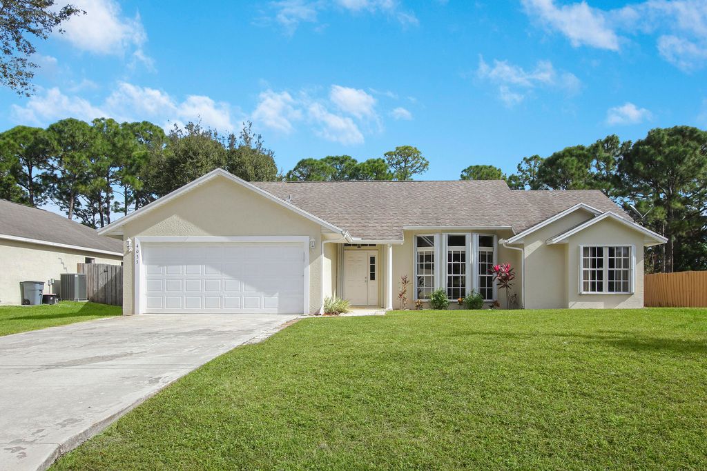 Photo of 4033 SW Kamsler Street, Port Saint Lucie, FL 34953 (MLS # R10768166)