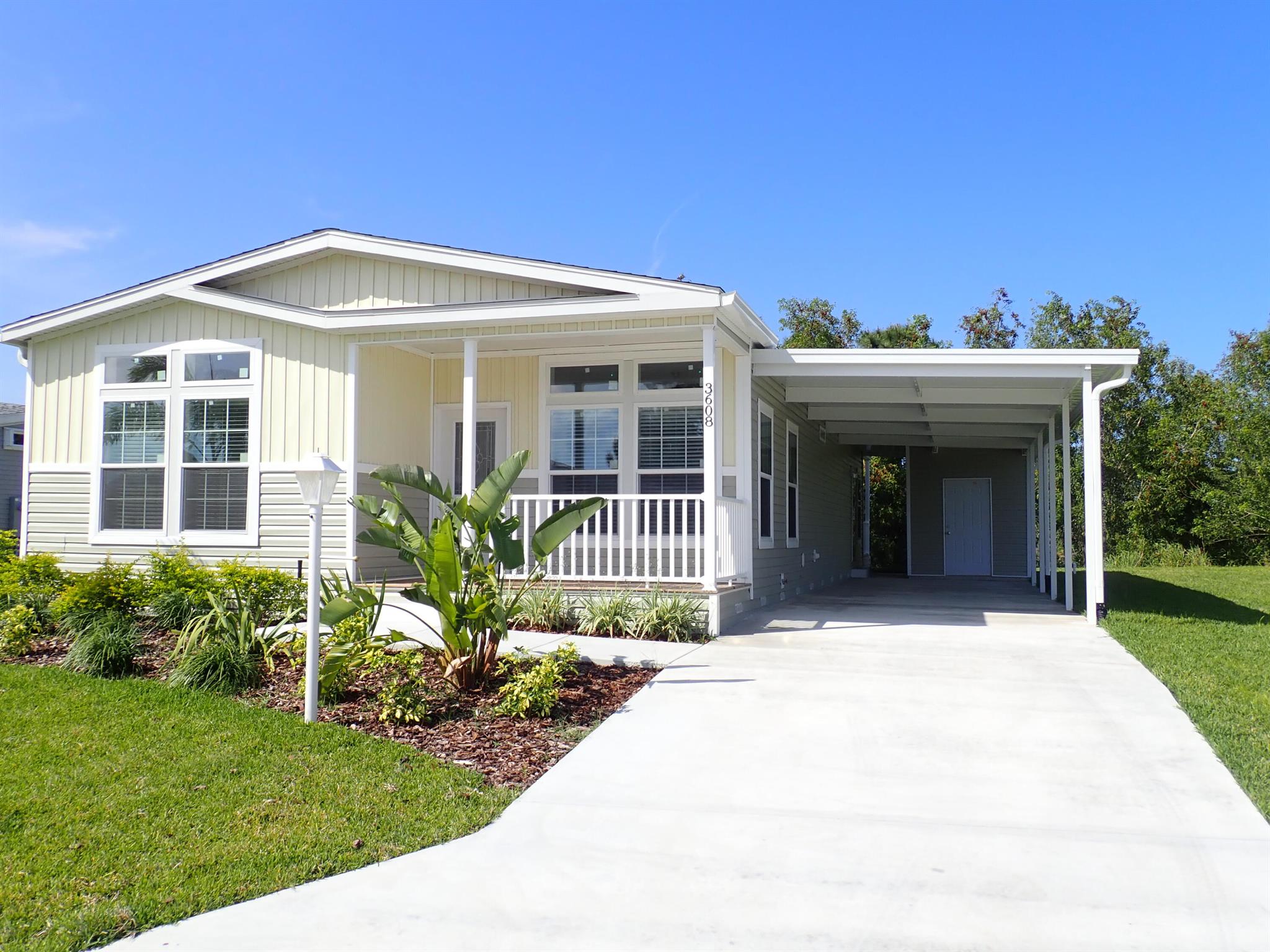 New 2023 home that backs up to the Savanna Preserve. This 2 BR, 2 BA home with a den is sure to delight. A Grand kitchen with SS appliances, center island, wine cooler, modern fixtures and even a pot filler over the stove. Luxury laminate flooring in the main areas of the home. Also, there is a deep carport for your golf cart and vehicles. Sit outside and relax on your front covered lanai or sit on the expansive back covered porch and view nature! Savanna Club is a 55+ Community with a golf course, 3 pools, 3 clubhouses, pickleball, tennis courts, an onsite restaurant, a theater and numerous clubs and activities to keep you active. Only a short drive to the beach and medical facilities. All measurements are approximate. Buyer to verify. Taxes are based on vacant land only. Land Lease