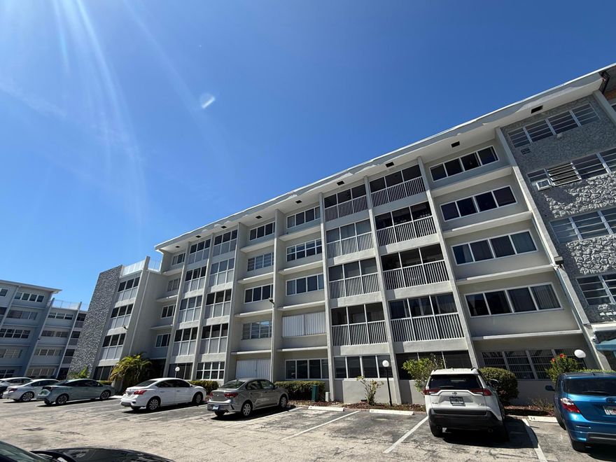 IMPACT WINDOWS!! NEWER APPLIANCES!! Step into comfort and style in this beautifully updated 1-bedroom, 1.5-bath condo. The unit showcases a modern kitchen with upgraded appliances, tastefully renovated bathrooms, and sleek vinyl flooring throughout, creating a bright and inviting atmosphere. Residents can take advantage of great community amenities, including a clubhouse, resort-style pool, and assigned parking. The HOA covers water and basic cable for added convenience. Ideally situated just minutes from the beach, Gulfstream Park, and Aventura, this location offers easy access to shopping, dining, and entertainment.