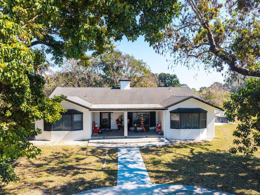 TOTAL PRIVACY ON 1.23 ACRES! NEW IMPACT WINDOWS/DOOR! OPEN CONCEPT, BAY WINDOWS, QUARTZ KITCHEN, SS HOOD, UPDATED APPLIANCES! TRIPLE SPLIT PLAN, MAIN BDRM NEW UPGRADED BATH, 2 WALK-INS & TANKLESS WTR HTR! IN-LAW SUITE HAS SPA TUB. 5TH BR CAN BE PVT OFFICE+LIBRARY+SITTING RM OR HOME SCHOOL! LGE LAUNDRY ROOM. ENJOY OUTDOOR ENTERTAINING ON ROOFED PATIO/POOL/NEW THERAPEUTIC HOT TUB! EXTENSIVE BACK YARD-HUGE PVT REAR DRIVE HOLDS MANY CARS, TRUCKS, BOATS, MOTOR HOMES! 1200 SQ FT WORKSHOP TOTALLY REBUILT! NEW 26K GENERATOR & 1K GAL GAS TANK! EXC. SCHOOLS, HORSES WELCOME, ACCESS DAVIE'S REC TRAILS, SHOPPING, DINING, HOUSES OF WORSHIP & HIGHWAY ACCESS! A WONDERFUL PLACE TO CALL HOME! CREDIT FOR NEW ROOF AT ASKING PRICE, NOT FOR CONDITION, JUST AGE.