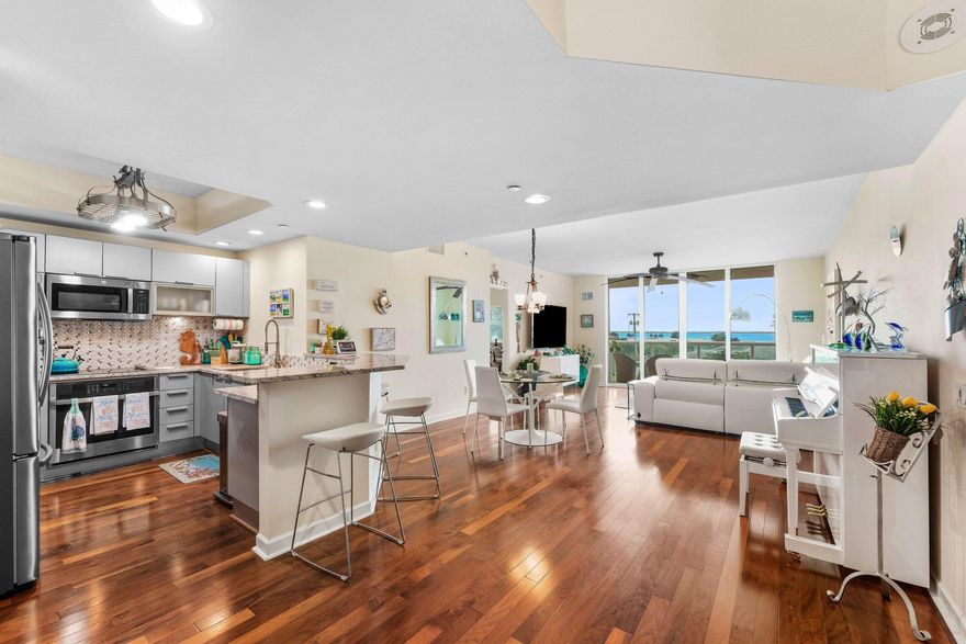 Beautiful 3rd floor END UNIT w/2BR + den, 2BA overlooking the Intracoastal, wood floors, impact glass, semi-private elevator access. Open concept, split floor plan with spacious owners suite w/his & her walk-in closets. Amazing primary bathroom w large walk in shower, glass enclosure, modern finishes with a spa like feel! Assigned garage parking & climate-controlled storage unit. 24/7 manned gate, valet. Newly renovated rooftop oasis w/pool, spa, BBQ areas, tennis/pickleball. Walking path w/gazebo, clubhouse, billiard room & fitness center. Adjacent marina w/dry docks available, minutes to ocean; no fixed bridges! Pet friendly & social community.