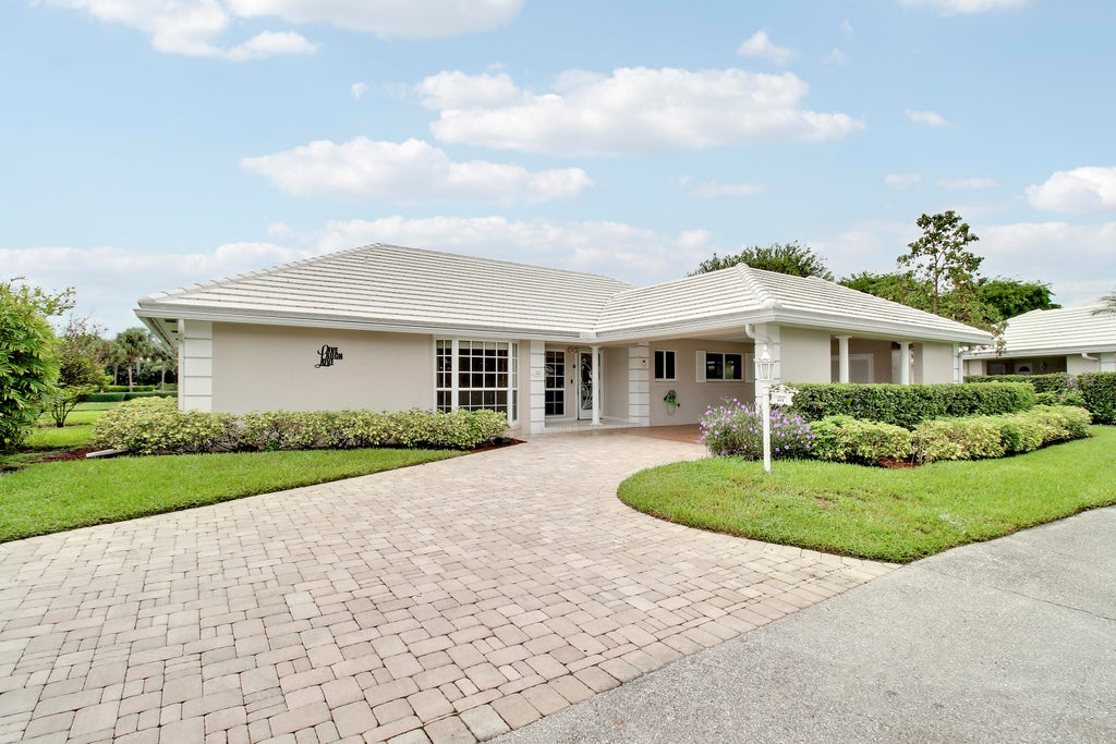 Photo of 442 FRENCH ROYALE Circle, Atlantis, FL 33462 (MLS # B26079177)