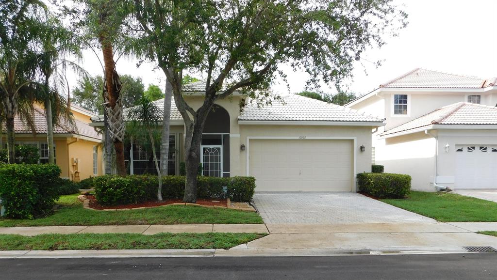 Gorgeous Richmond Model on premium lot with no rear neighbors. Kitchen features large wrap around island with granite countertops. Live in style in this single story, tile floors throughout the living space. All of the bedrooms have wood floors, Master has 2 walk-in closets. Plantation shutters throughout, and floor to ceiling sliding plantation shutters in Master. Extra large sliding glass doors lead onto a large shaded screened lanai with landscaping surrounding home.