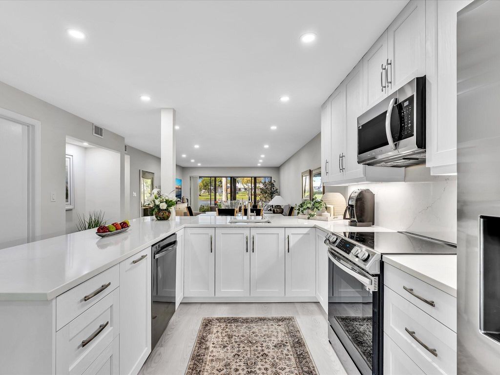 Photo of 5056 Oakhill Ln, Delray Beach, FL 33484 (MLS # B26001146)