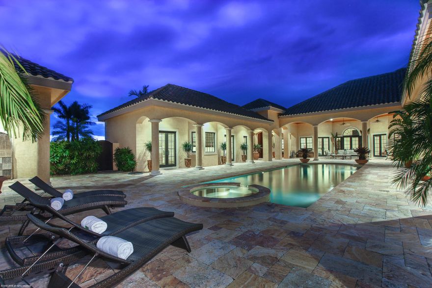 Location, location, location. Pristine estate home with adjacent equestrian center is a breathtaking property. With 5 bedrooms and 6.5 baths, two fireplaces, impact glass, and generator, the bright home exudes comfort and elegance. The courtyard features an oversized lap pool, heated spa, and guest house all with marble decking and an entertainment area with outdoor shower. The residence and 14-stall center-aisle barn sit on two lots spanning 10.78 acres Overlooking a new GGT arena, grass riding field, and luscious paddocks. The barn features a roomy owner's lounge, two studio apartments and manager's quarters. Located by the bridge to Grand Prix Village, just a short hack to Palm Beach International Equestrian Center.