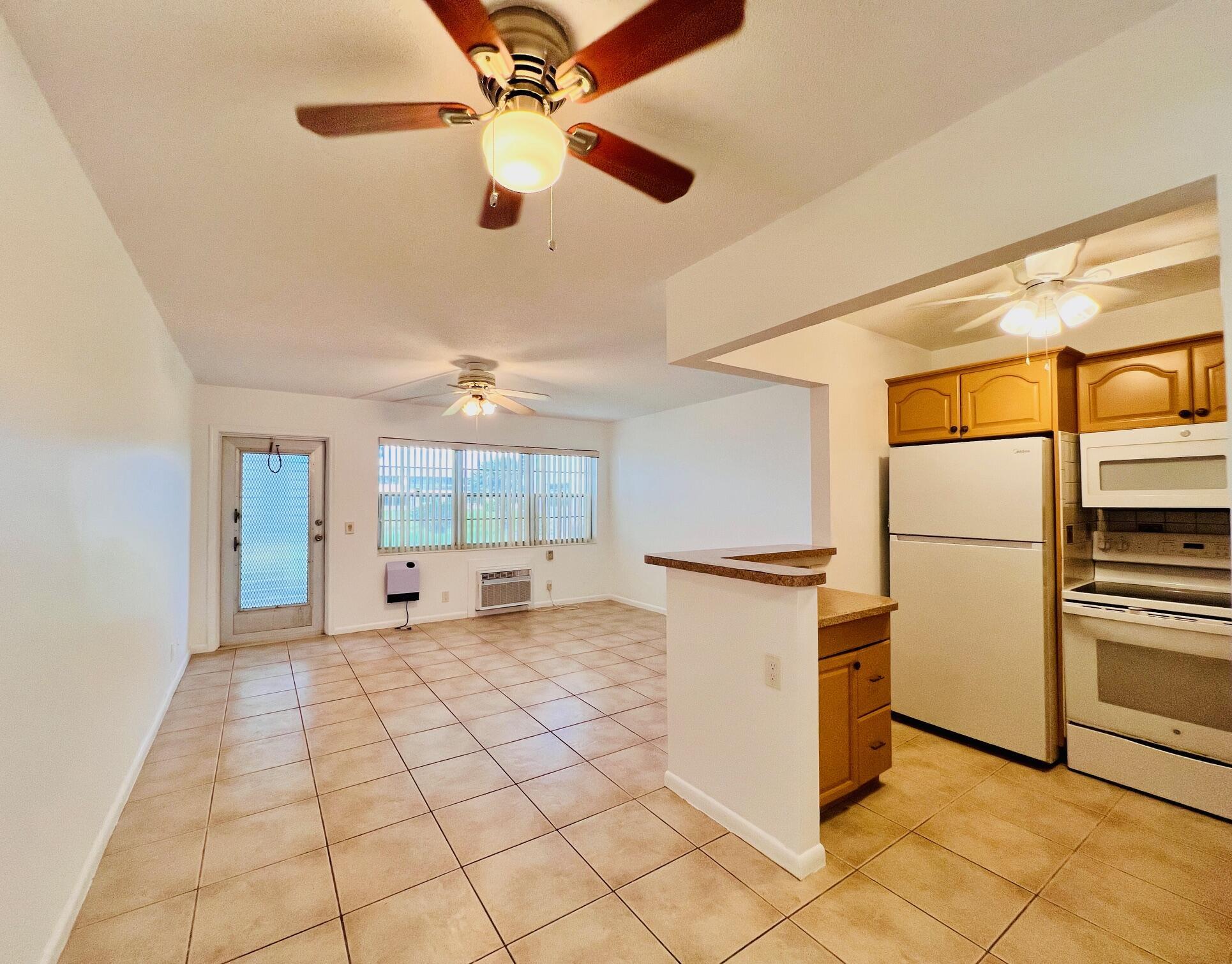 Beautifully Maintained With WATER VIEWS In 55+ Century Village! Move In Ready and WELL PRICED One Bedroom/One Bath FIRST FLOOR Century Village Condo. Enjoy Views of Greens Space And Water Beyond From the Front of the Unit. Nicely Updated & Open Kichen With Full Appliance Package - Including A Dishwasher! Neutral Tile Flooring Flows Throughout. Long Lanai With Door to Access Your Assigned Parking Spot. Fantastic Location Close to the Popular Kent Pool. Century Village Is A Vibrant 55+ Community Centrally Located In Highly Desirable Palm Beach County, Florida. Enjoy An Active Lifestyle With Resort Style Amenities...