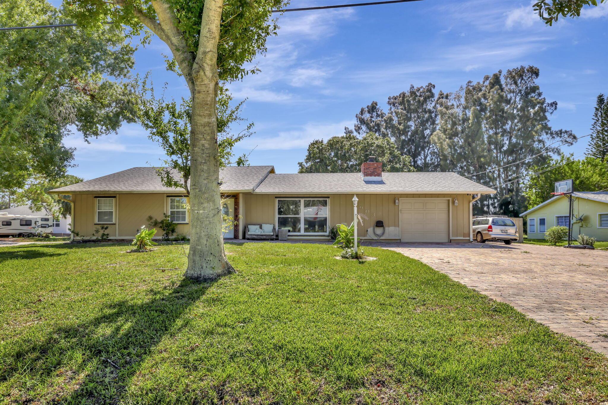 Pool home on an oversized corner lot in the desirable Indian River Estates neighborhood. Recent updates include a 2020 roof, 2023 A/C, and a tankless water heater. The backyard is set up for easy Florida living with a private pool, outdoor shower, and RV hookup. Inside, a working wood-burning fireplace adds character, and with county-only taxes, you'll save on your annual expenses. A great opportunity to own in a quiet, established community with no HOA.