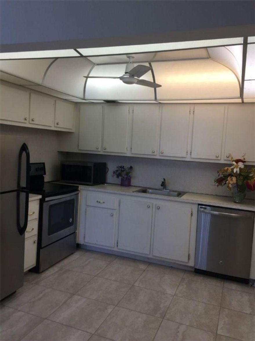 Location Location! Walk to clubhouse and pools. Newly Tiled & painted. Enclosed Florida Room. New Appliances. Association claims 55+
