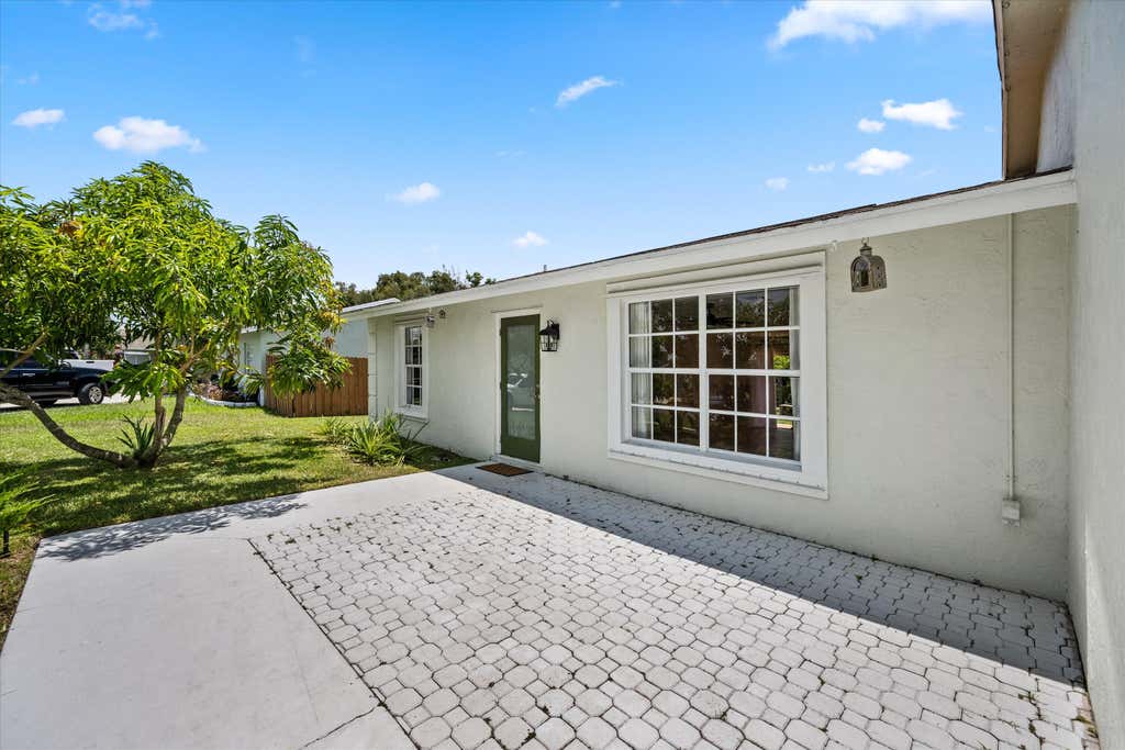 Photo of 143 Bobwhite Road, Royal Palm Beach, FL 33411 (MLS # B26058777)