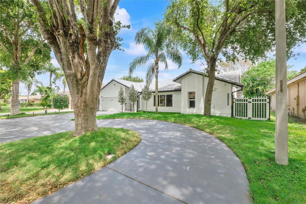 Photo of 5022 NW 45th Ave, Coconut Creek, FL 33073 (MLS # F10506508)