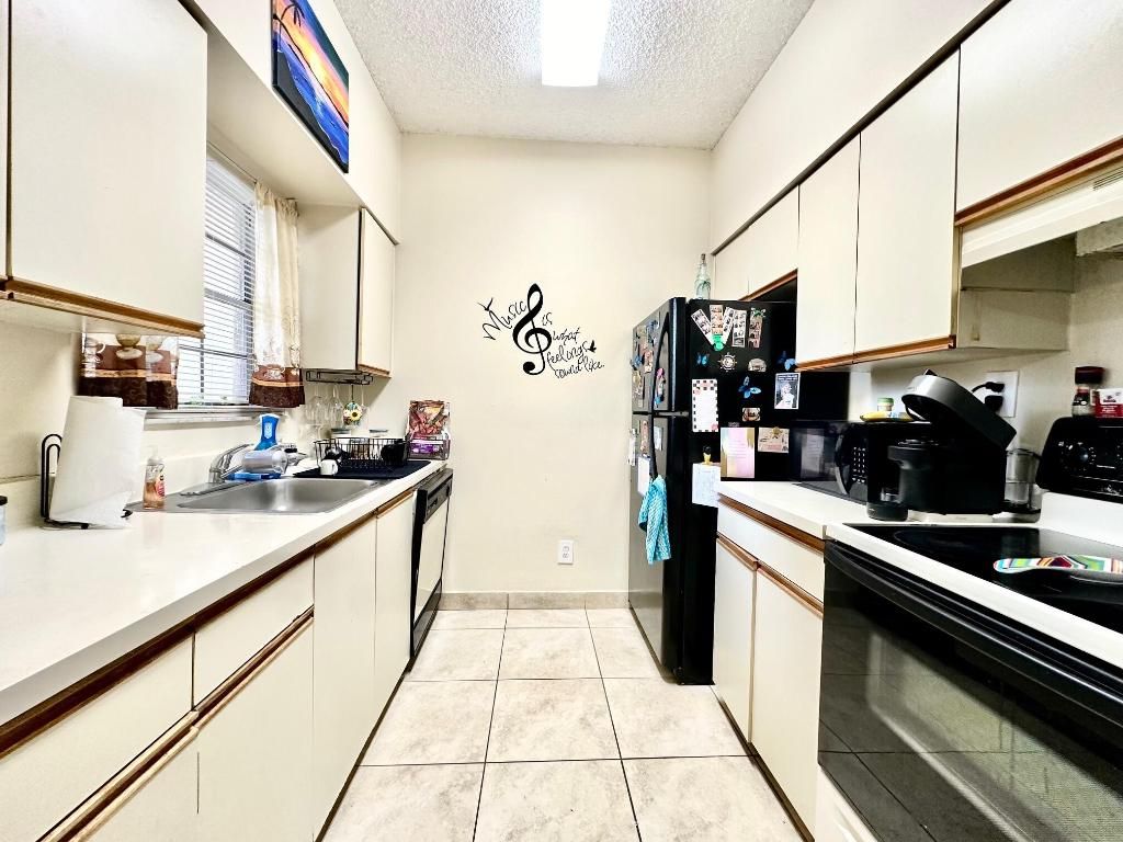 Photo of 661 Cypress Lake Boulevard #F, Deerfield Beach, FL 33064 (MLS # R11136901)