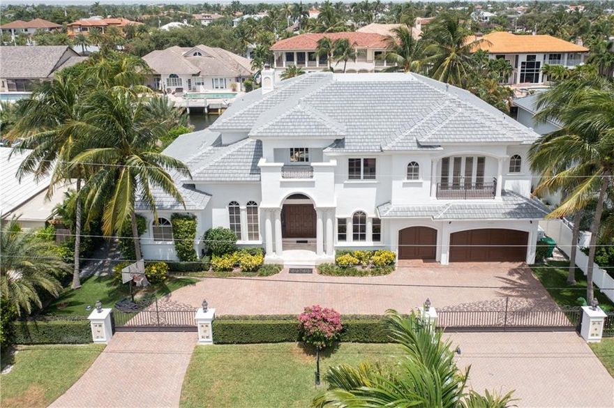 Prestigious Royal Palm contractor built home; new roof & ext. paint in 2021 with remodeled pool/patio all on pilings; 100’ waterfront; new 80’ dock, 100/50 amp service; 5K lb lift. 5 mins from your dock to Hillsboro Inlet!  Hurricane protection; diesel 22KW whole house gen.; lightning protection.  New A/C's/hot water heater; A/C in 3 car garage. Inside you will find remodeled kitchen w/gas Viking Pro stove; dual Sub Zero frig/freezer & 48 bottle wine cooler + 1,000 bottle wine rm; 2 dishwashers.  1st floor offers a waterside family room, breakfast area, formal dining & living room, a private office, grand suite with sitting area, separate walk-in closets & wet areas in grand bath. Second floor offers 4 bedroom suites including media room with wet bar, MOST AMAZING waterside exercise room. Built by one of the most prestigious contractors known for his work in Royal Palm, Boca Raton.  This custom home with an inviting remodeled pool and travertine patio outdoor lifestyle is all built on pilings with 100’ of waterfront, 80’ new dock (2020) with concrete pilings and LED lighting, 100 & 50 amp services including 5,000 lbs. boat lift for your runabout.  From your dock to the Hillsboro Inlet is literally 5 to 6 minutes – a boater’s dream!  Complete hurricane protection with auto diesel 22KW whole house generator; security gates with cameras in and out of home; ADT security; lightning protection all for peace of mind.Brand new roof and exterior paint in August 2021!  New A/C systems and hot water heater in 2020; new A/C in 3 garage w/epoxy floors and additional storage! Inside you will find remodeled kitchen with gas Viking Pro stove; dual Sub Zero frig/freezer & 48 bottle wine cooler plus 1,000 bottle wine room; 2 dishwashers.  The first floor offers a waterside family room with breakfast area, formal dining and living room, a private office and grand suite with sitting area, separate walk-in closets and wet areas in the grand bath.The second floor offers four bedroom suites including an adjacent media/tv room with wet bar and the MOST AMAZING waterside exercise room.This home has it all and all well-proportioned
