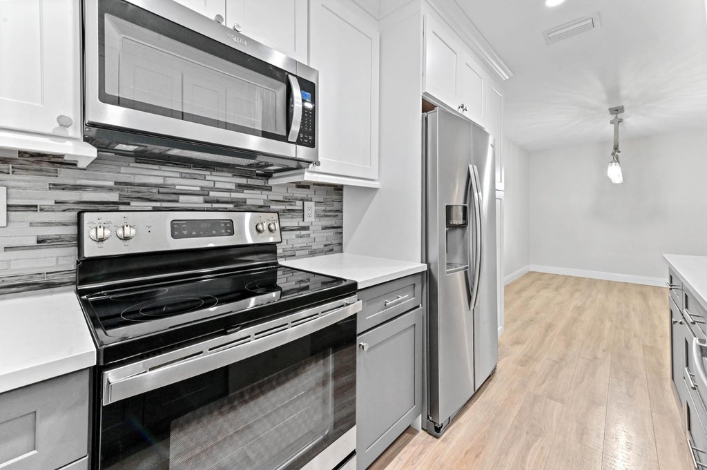 Photo of 1187 S South Drive Circle #C, Delray Beach, FL 33445 (MLS # R11050166)