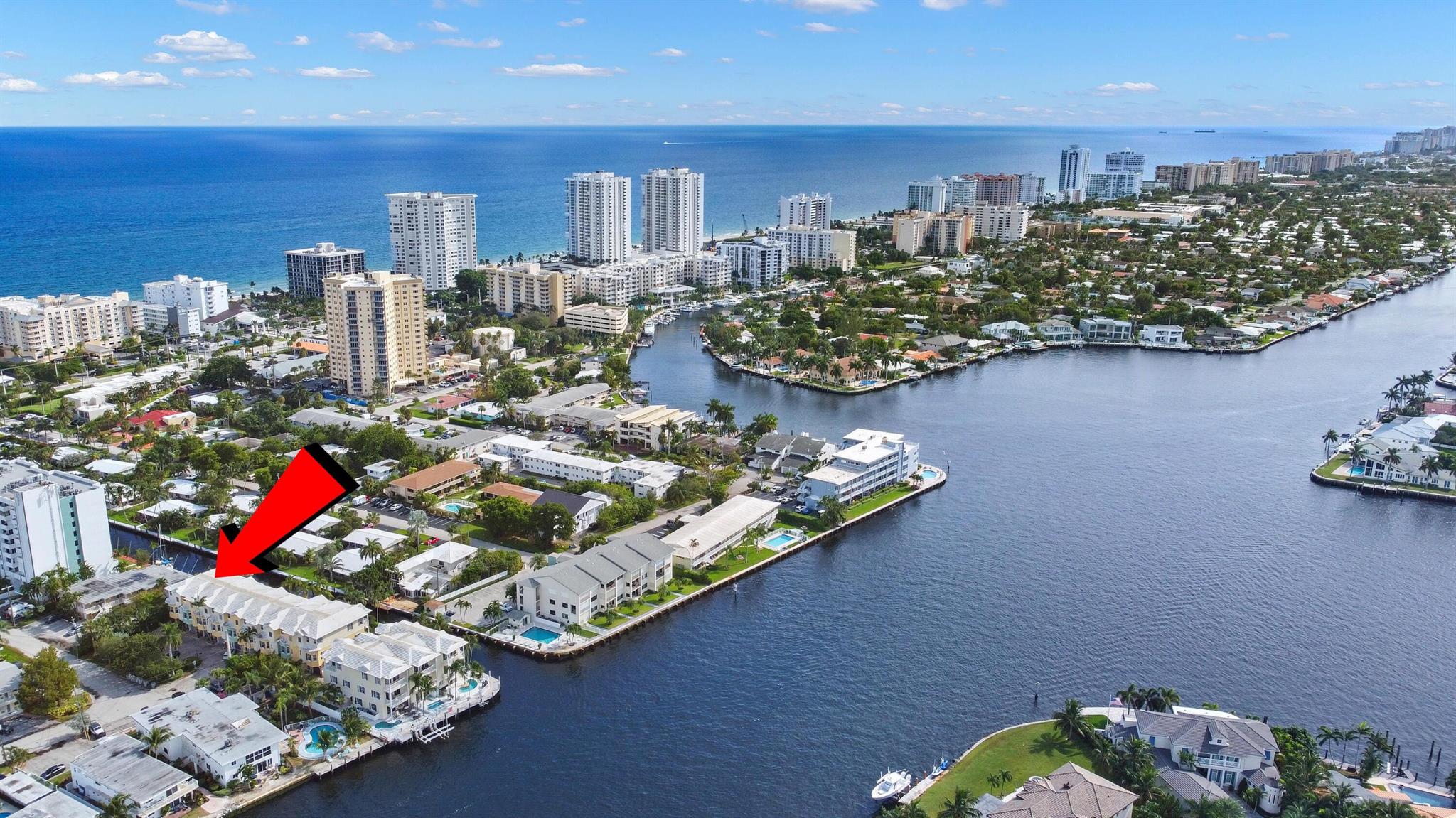 Welcome home to this beautiful deep water canal townhome, minutes from the beach. Rarely available 3 bedroom + den / 4 bath / private pool Waterfront Townhome, blocks from the ocean with a 39' deeded dock. This tri-level townhome, features an elevator, bright light southern exposure & Intracoastal views. Ground level, family entertainment, private pool, & 39' dock right out your back door. Rich features: chisel-edged marble flooring on two floors, upgrades throughout great master with shower and tub, Central Vac. Upgraded kitchen, stainless steal appliances & quality cabinetry. Hurricane impact doors & windows, concrete block construction between residences for additional security & privacy. This is a Boater's dream, No fixed bridges, quick ocean access. One car garage and guest parking.