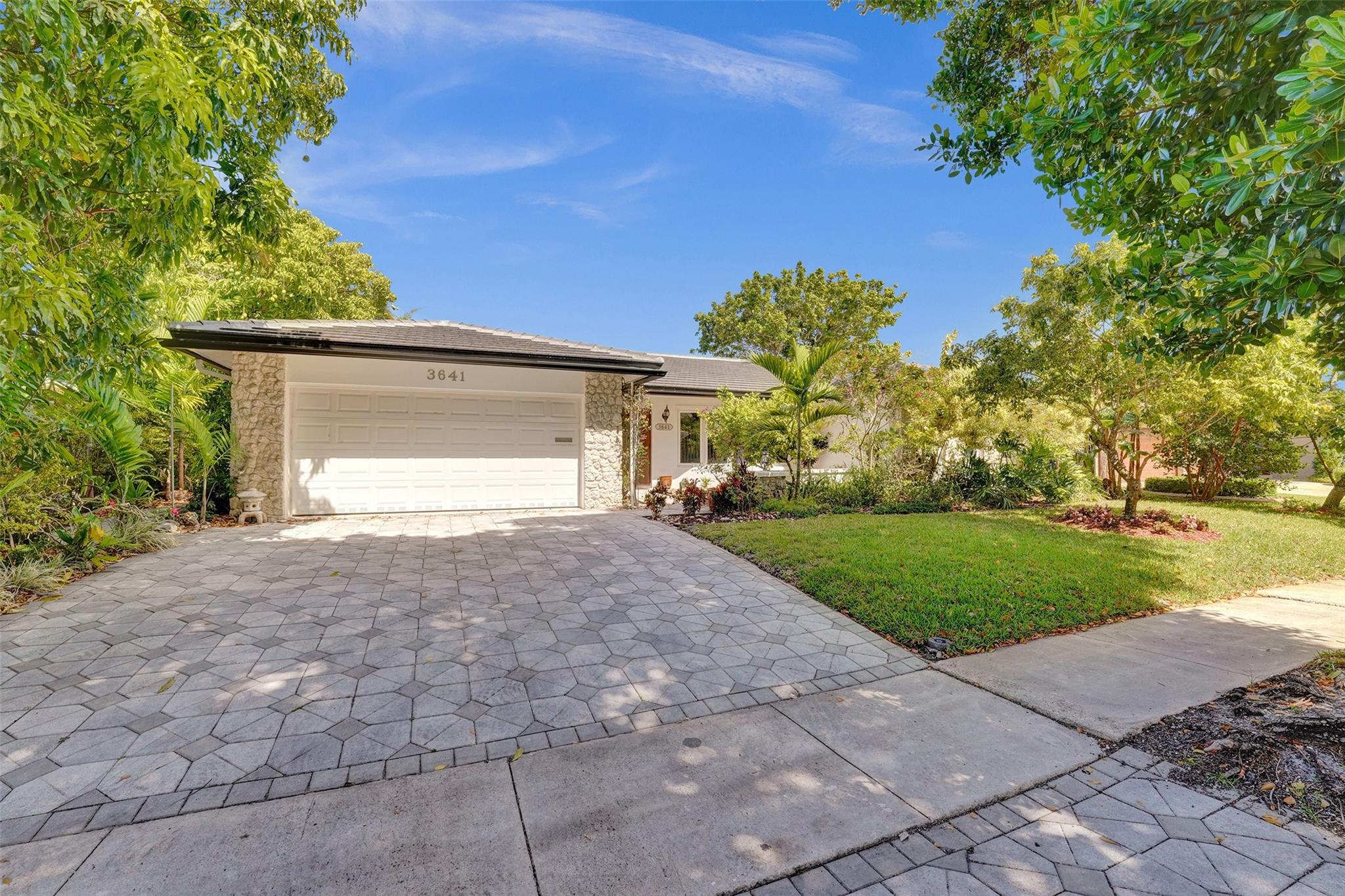 LOVINGLY OWNED BY THE SAME OWNERS FOR 29 YEARS, THIS ALMOST 3000 SQ FOOT 4 BEDROOM, 3 BATHROOM HOME OFFERS INCREDIBLE SPACE AND COMFORT. THE LAYOUT INCLUDES A FAMILY ROOM AND A FLORIDA ROOM WITH WALL TO WALL SLIDING GLASS DOORS THAT OVERLOOK THE POOL AND LUSH LANDSCAPING. THE EXPANDED MASTER BATHROOM OFFER A SEPARATE SOAKING TUB AND WALK-IN SHOWER. UPGRADED KITCHEN APPLIANCES. THE MAJOR UPGRADES HAVE BEEN DONE. IMPACT WINDOWS AND DOORS, NEW ROOF AND A/C'S (2024). ALL WITH PERMITS! TUCKED WAY ON A BEAUTIFUL PRIVATE STREET. WALKING DISTANCE TO HOUSES OF WORSHIP. CLOSE TO SHOPPING AND THE BEACHES.