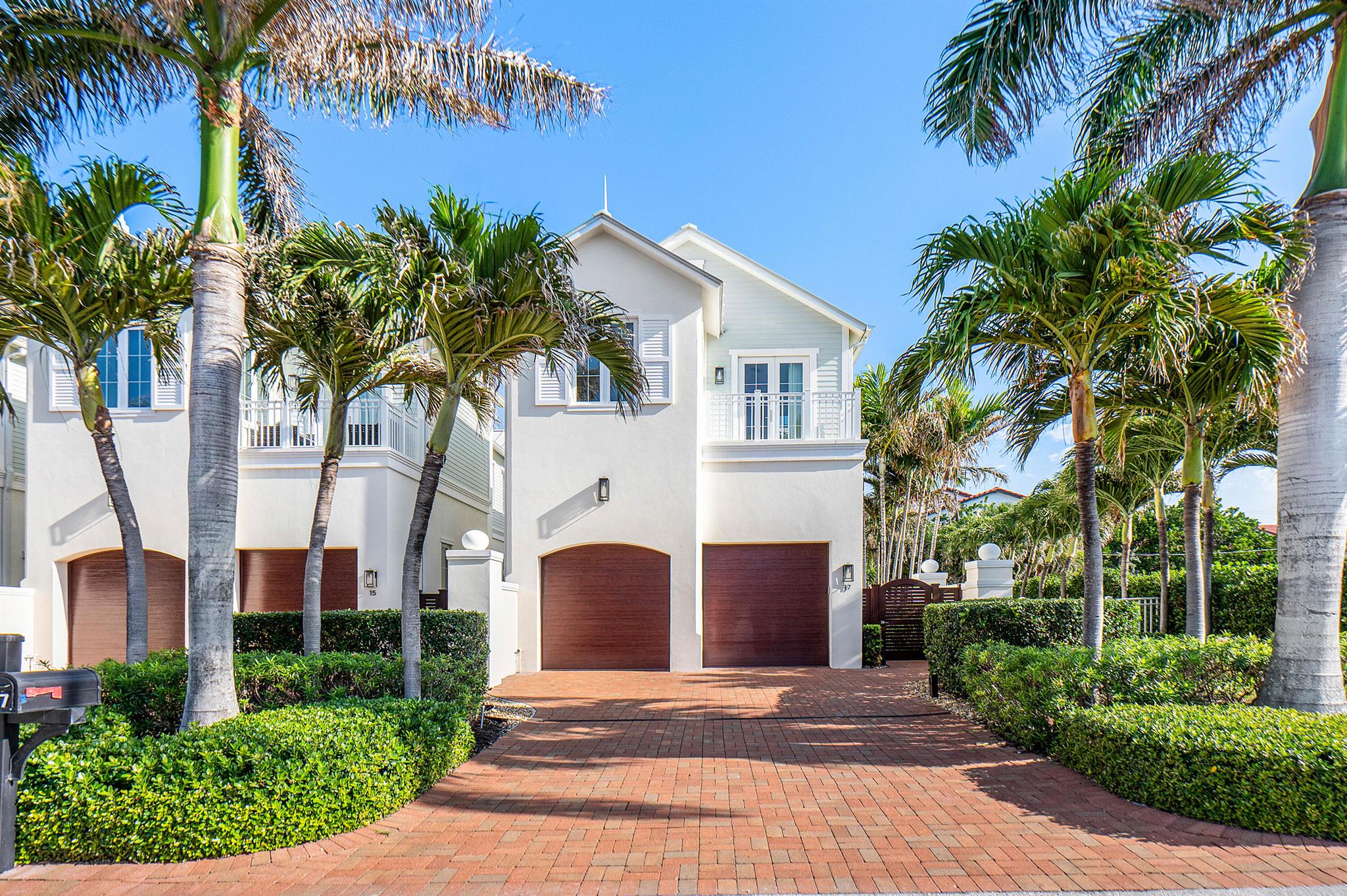 Corner Villa with Ocean Views, Steps from the Sand! Bitcoin transaction is available- property can be purchased with Bitcoin.Welcome to 17 Adams Road, a private corner villa in the heart of Ocean Ridge, one of South Florida's most exclusive beachside communities. Just 380 feet from deeded beach access, this luxury 3-bedroom, 3.5-bath residence offers a rare combination of coastal charm, privacy, and modern elegance--highlighted by ocean views from the primary suite.Spanning 2,874 square feet under air, this premier east-facing corner unit lives like a single-family home, offering refined comfort with the convenience of villa living. A three-car garage with hydraulic lift, impact windows, motorized shades, and plans for an optional elevator add everyday ease to this exceptional home